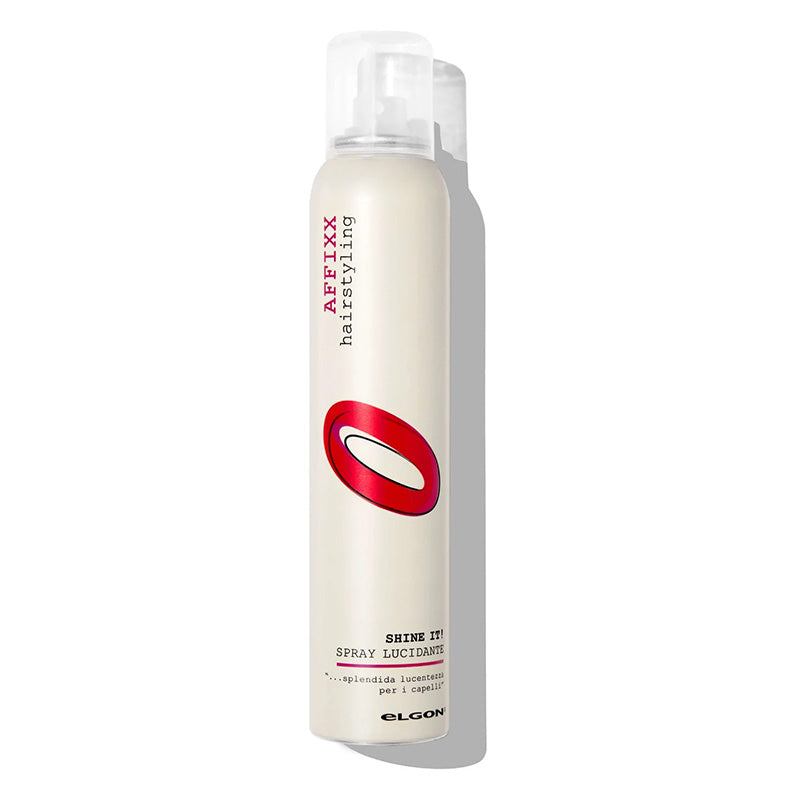 Spray illuminante in flacone bianco e rosso. Dona lucentezza ai capelli dopo l'asciugatura.