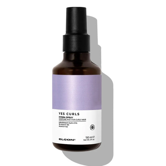 Spray per capelli ricci con vitamina B5 e Hydra Oil. Flacone marrone con tappo spray, etichetta bianca e viola