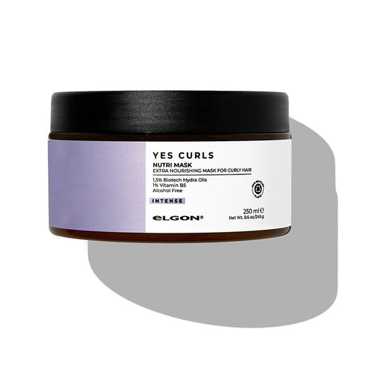 Maschera per capelli ricci grossi e chiome folte. Vasetto marrone con tappo nero, etichetta bianco e viola.